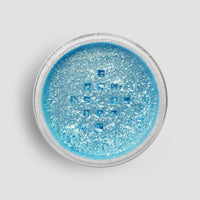 A round container of Jenna Rae Cakes Blue Sky Edible Glitter (5g Shaker, Pack of 6) filled with shimmering blue powder is viewed from above against a light gray background.