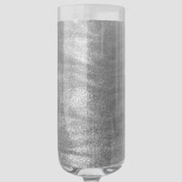 A sparkling silver liquid in a clear champagne flute showcases Jenna Rae Cakes’ Disco Ball Edible Glitter (20g, 3-pack), set against a light gray background.
