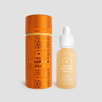 A small orange cylinder and a clear glass dropper bottle labeled “Liquid Pumpkin Spice - Package of 6” by Jenna Rae Cakes are set against a plain gray background.