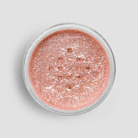 A round shaker of Jenna Rae Cakes Lucky Penny Edible Glitter (5g), with shimmery rose gold powder, viewed from above against a light gray background. Sold as a package of 6.