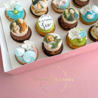 A box of The Works Cupcakes by Jenna Rae Cakes features pastel swirls, edible classical painting images, and white chocolate toppers. One cupcake says Happy Birthday Leo, all presented in a signature pink Jenna Rae Cakes box.