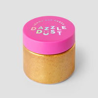 A set of three 20g containers of Jenna Rae Cakes’ 24k Magic Edible Glitter, each small jar with shiny gold powder and a bright pink lid, shown against a plain light gray background.