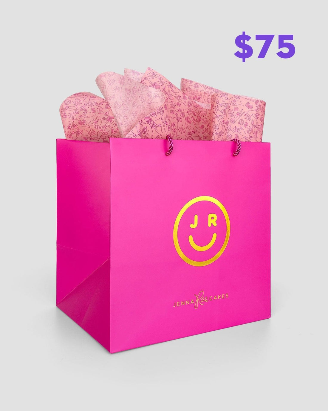 The $75 JRC Gift Bag by Jenna Rae Cakes features a bright pink bag with a yellow smiley face and JR logo, pink tissue paper inside, and Jenna Rae Cakes written on the front. $75 is shown in purple text in the top right corner.