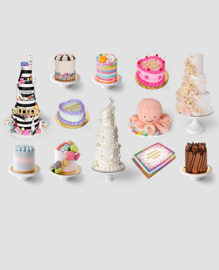 Twelve decorated cakes in various styles and colors are displayed on stands against a light gray background, including tiered, floral, animal-shaped, rainbow, and sprinkle-covered designs.