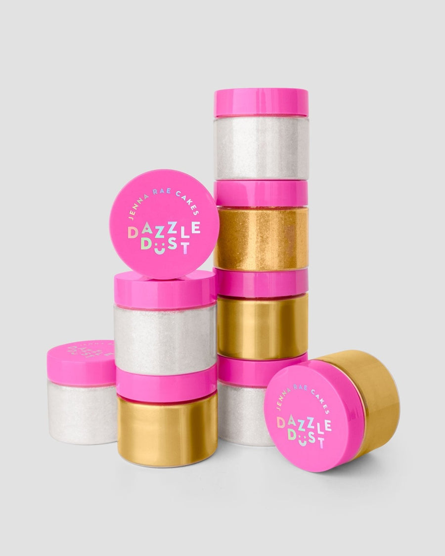 Three small jars with bright pink lids labeled Jenna Rae Cakes Disco Ball Edible Glitter (20g each) are stacked together, holding shimmering gold and white glitter. The package includes 3 containers, set against a light gray background.