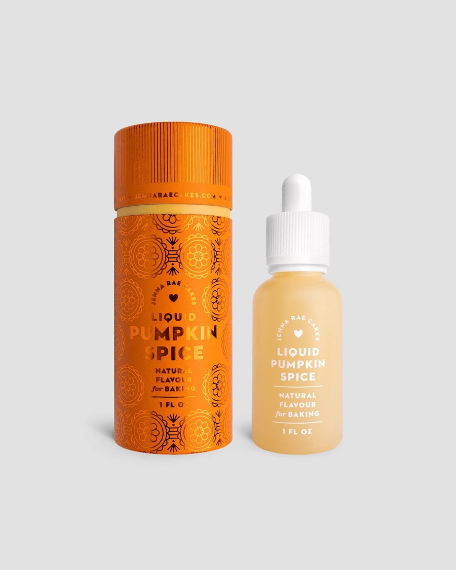 A small orange cylinder and a clear glass dropper bottle labeled “Liquid Pumpkin Spice - Package of 6” by Jenna Rae Cakes are set against a plain gray background.