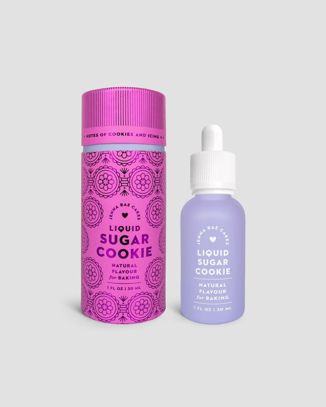 Two bottles from the Jenna Rae Cakes Liquid Sugar Cookie, Package of 6, are shown: a purple dropper bottle and a pink cylindrical container with patterns, both featuring the same label.