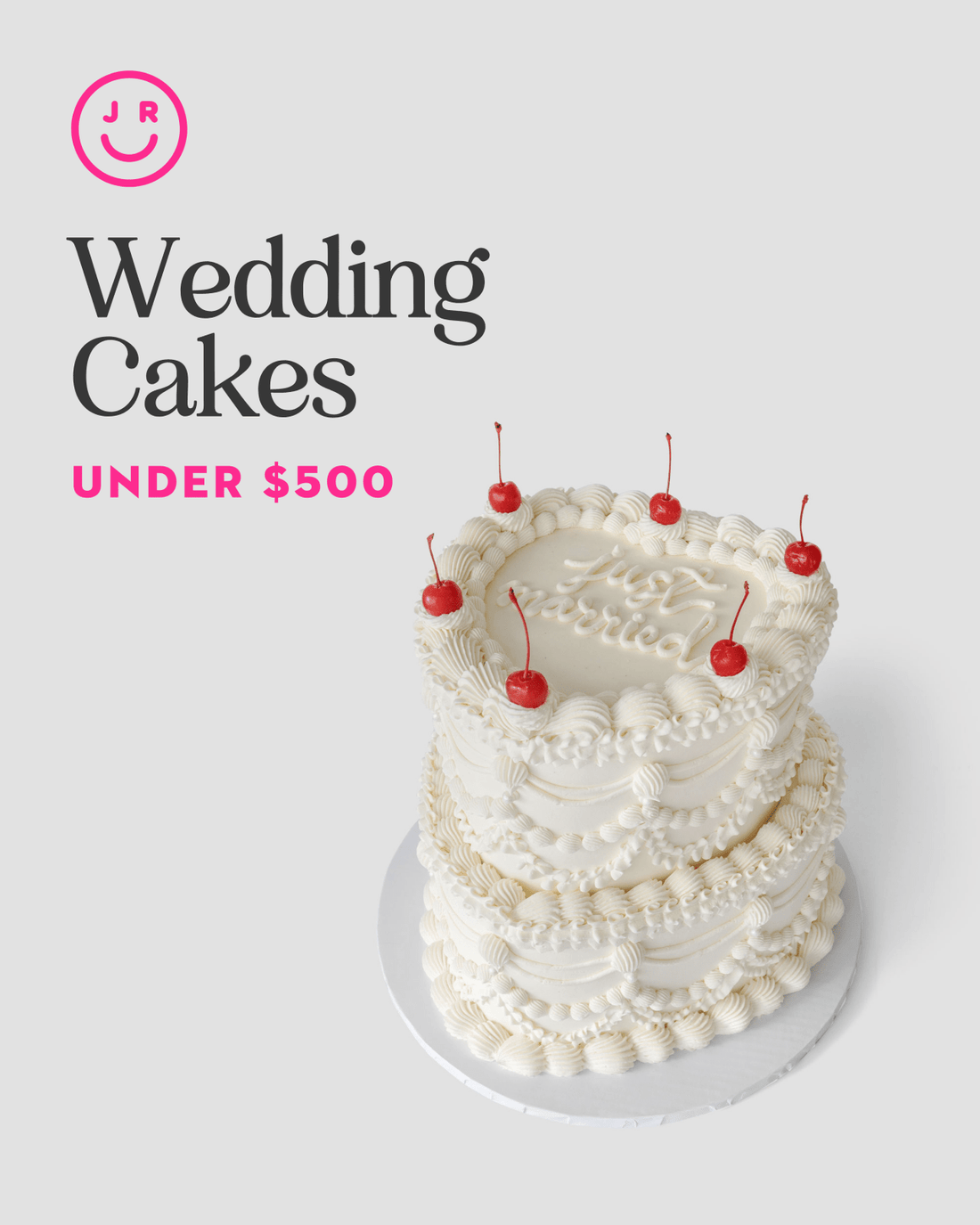 A three-tiered white wedding cake from Jenna Rae Cakes, decorated with cherries, sits on a white surface. On the left, text reads “Wedding Cakes Under $500” with a pink smiley face logo above.