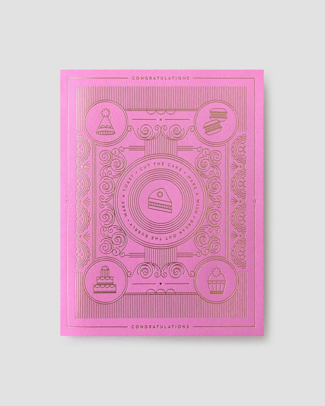 The Jenna Rae Cakes Congratulations Greeting Card is pink with gold-embossed cake slices, a cupcake, and ornate patterns, featuring the repeated words CONGRATULATIONS and CUT THE CAKE.