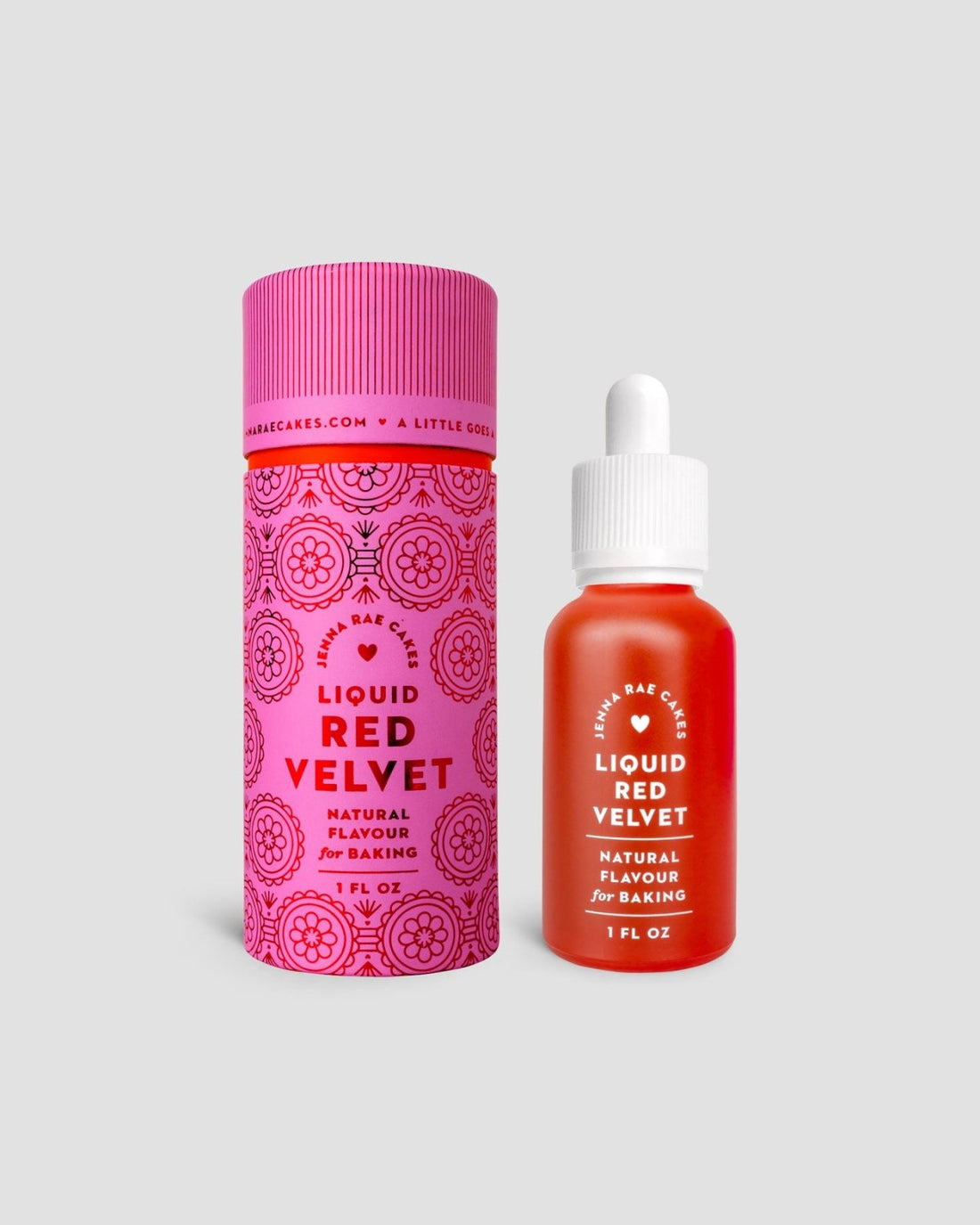 A 1 fl oz dropper bottle of Liquid Red Velvet by Jenna Rae Cakes is displayed beside its decorative pink and red cylindrical packaging on a light gray background.
