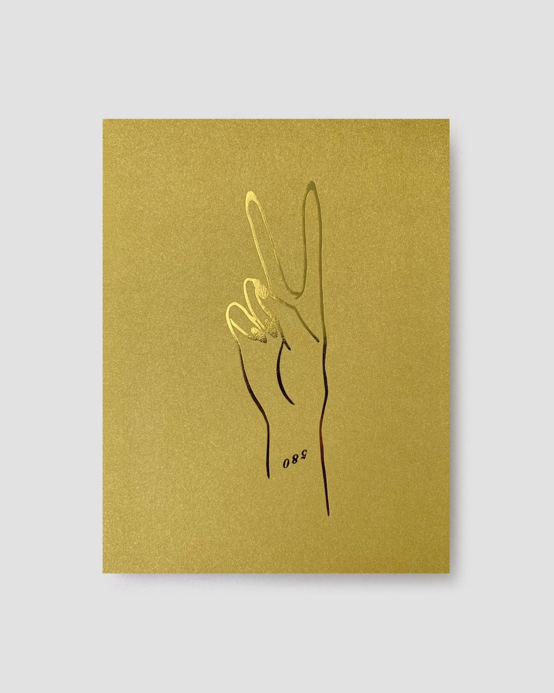 The Jenna Rae Cakes Peace Greeting Card features a minimalist line drawing of a hand making a peace sign, outlined in black and gold on a gold square background, with the number 088 near the wrist.