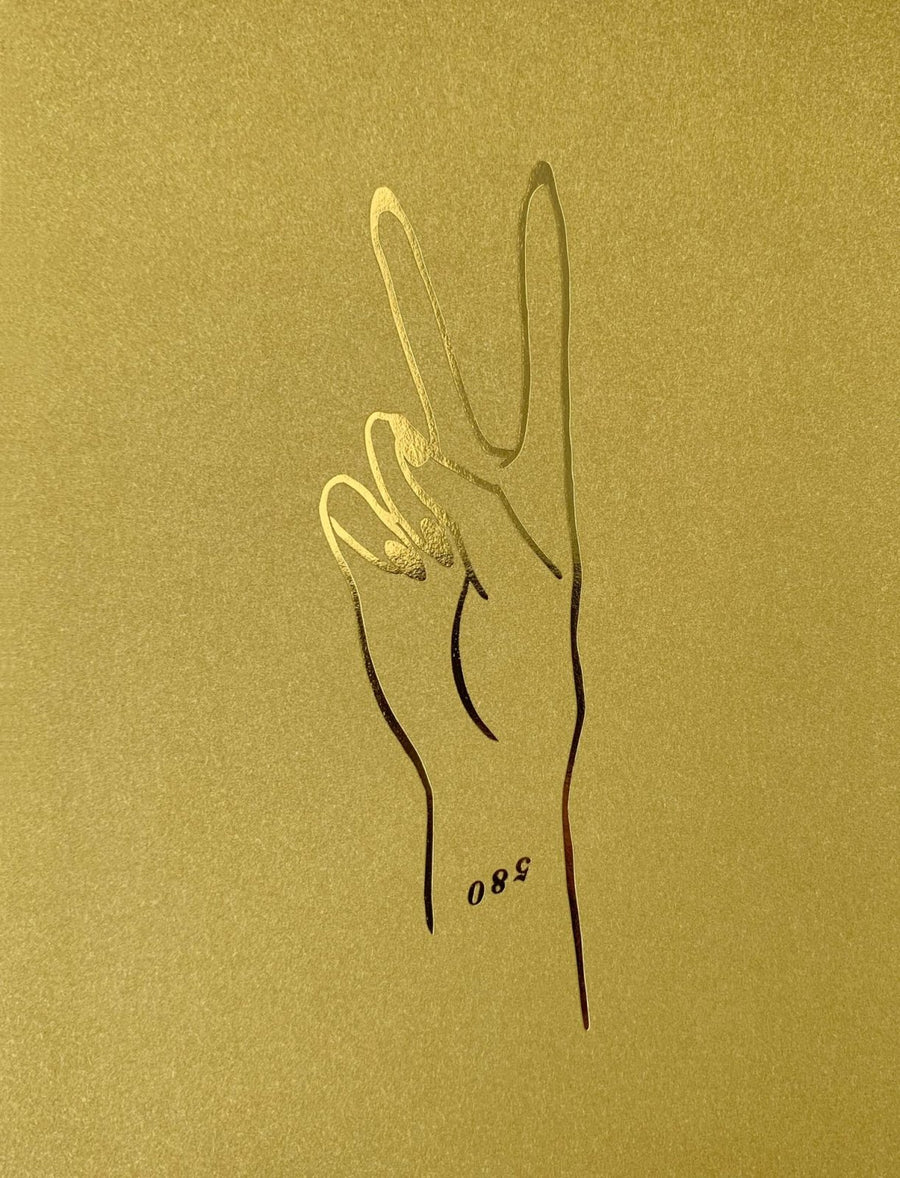 The Peace Greeting Card by Jenna Rae Cakes features a minimalist gold illustration of a hand making a peace sign, with the number 580 near the wrist.