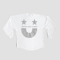 The White and Silver Spirit Jersey by Jenna Rae Cakes features two gray stars, “JENNA RAE CAKES” text, and a large gray smiley face on the back, shown on a plain gray background.